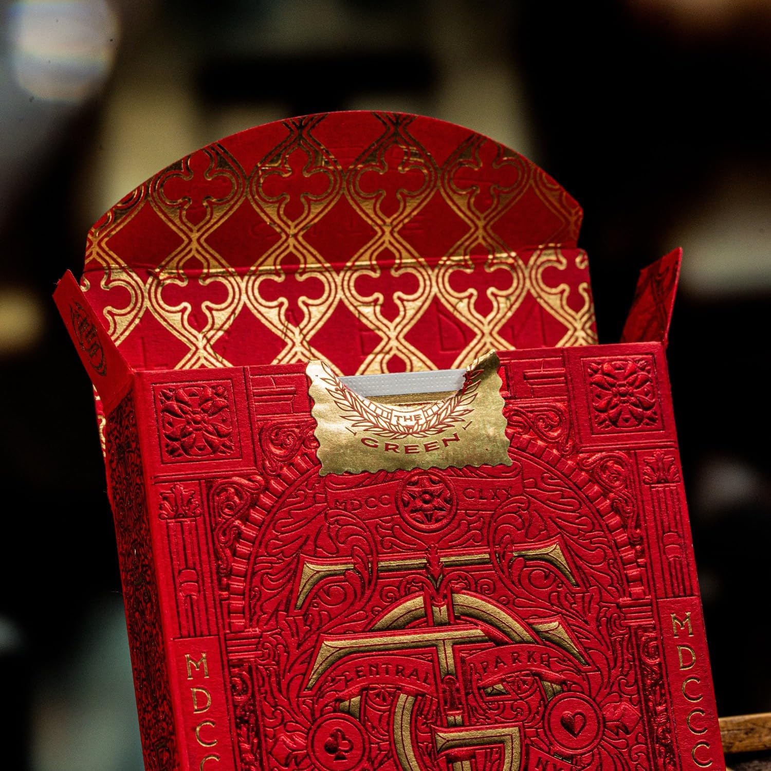 Open Tavern on the Green Red Edition tuck box showing gold interior pattern