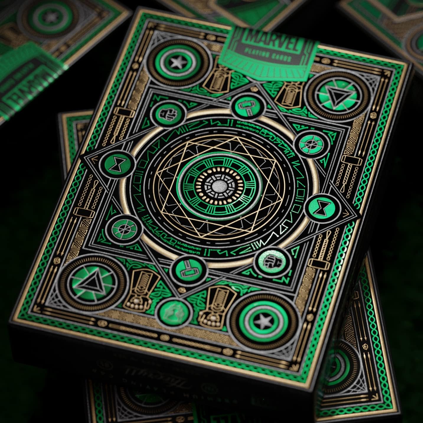 Marvel playing cards with green and gold design on a dark background