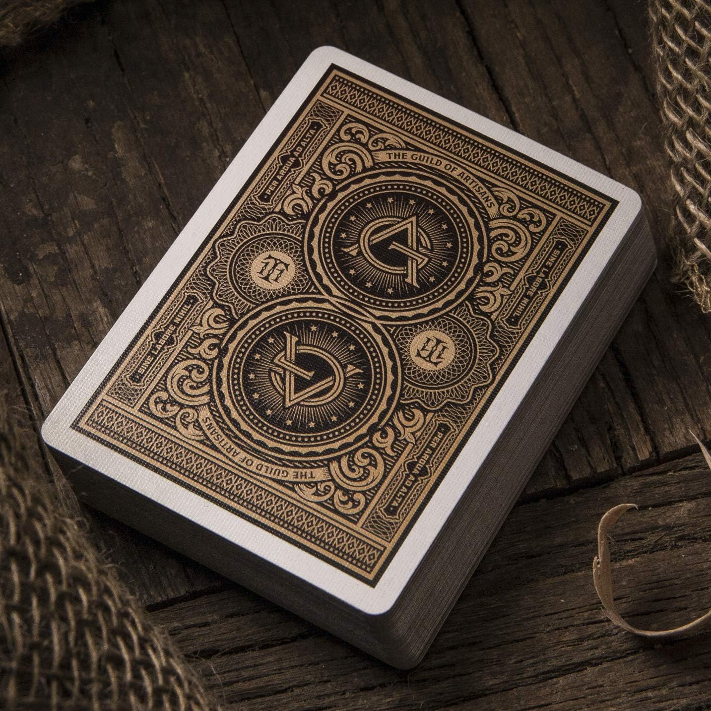 Close-up of a playing card with intricate design on a wooden surface
