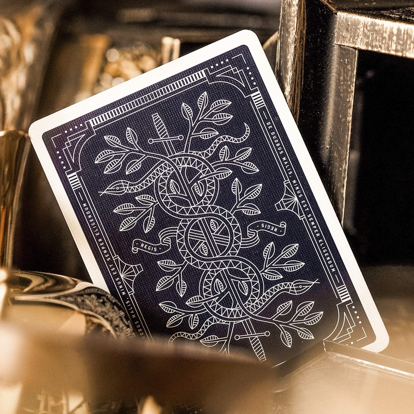 Blue Monarch playing card with intricate design on a dark background