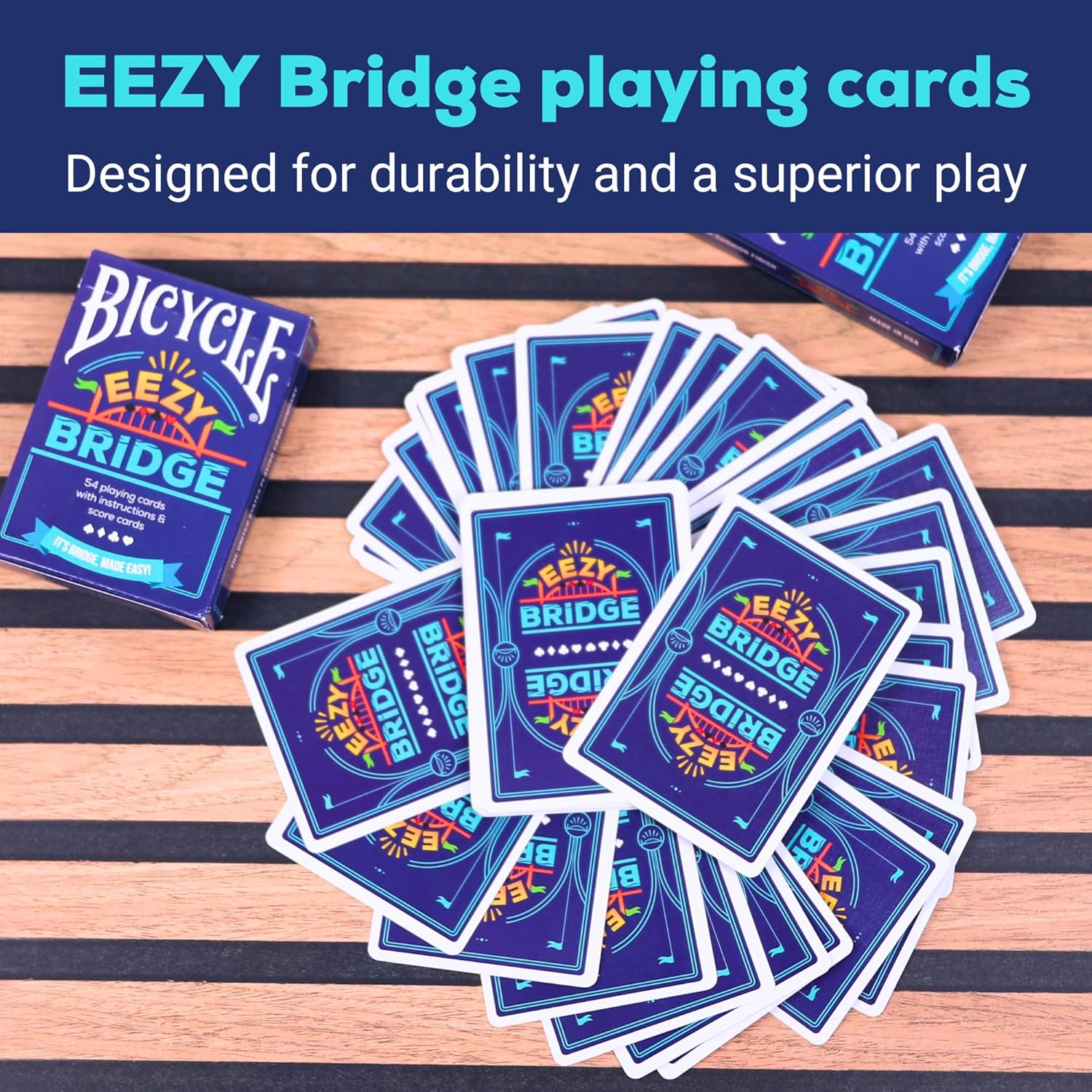 EEZY Bridge playing cards with packaging on a striped wooden surface
