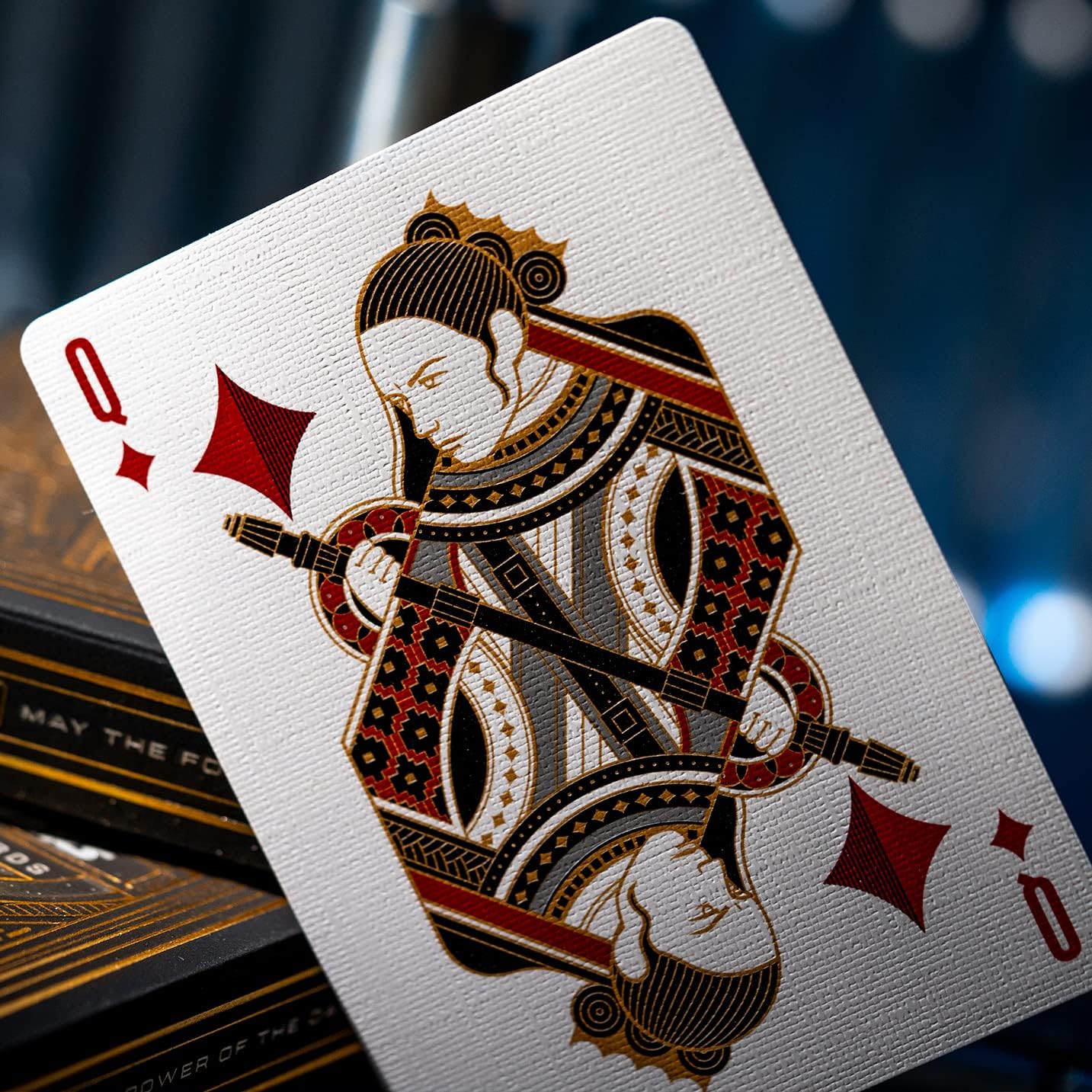Playing card with a detailed design of a queen, likely from a premium or themed deck.