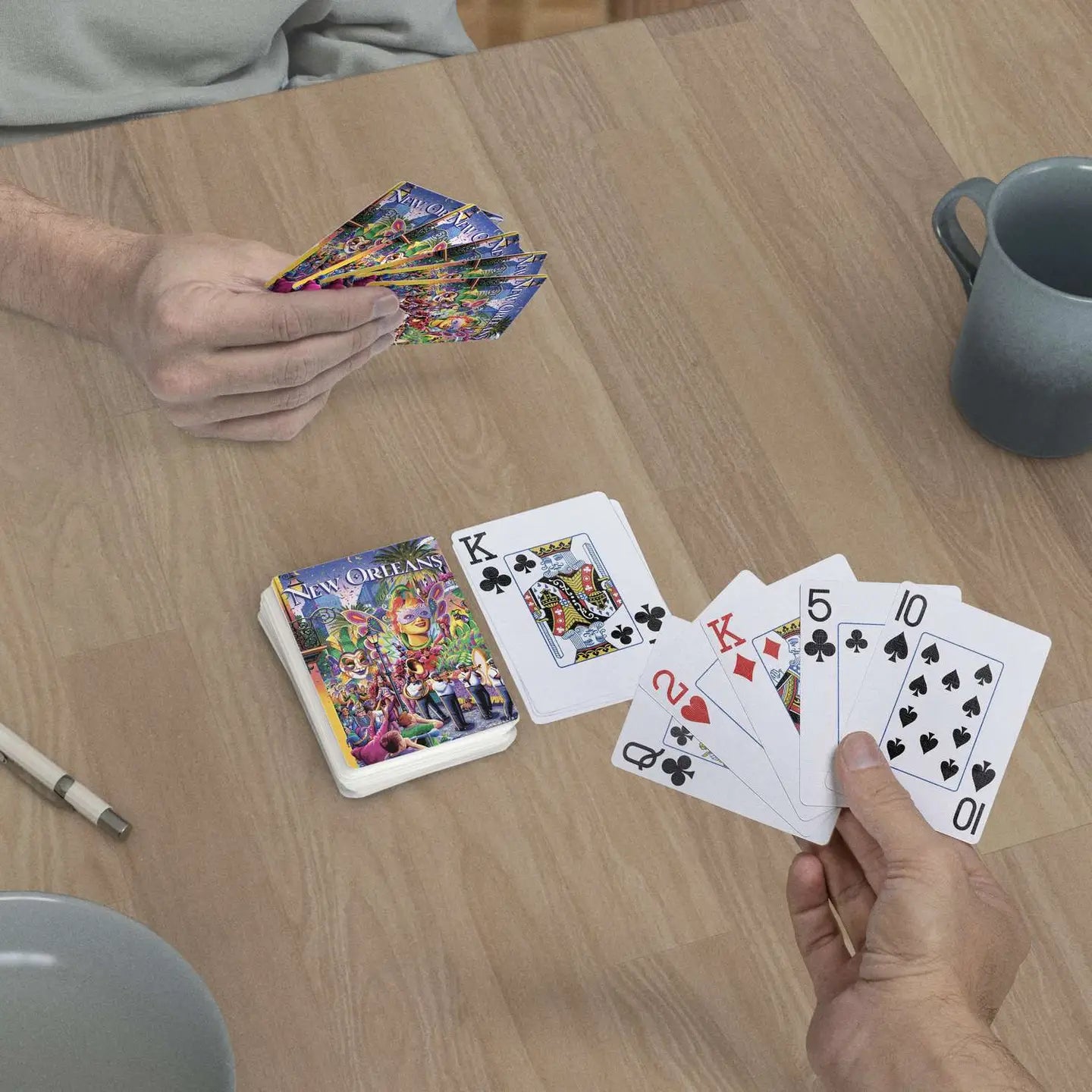 New Orleans Mardi Gras jumbo-index playing cards in use at a table
