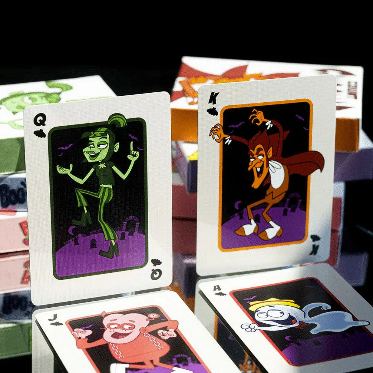 Count Chocula playing cards with cartoon characters on a reflective surface.