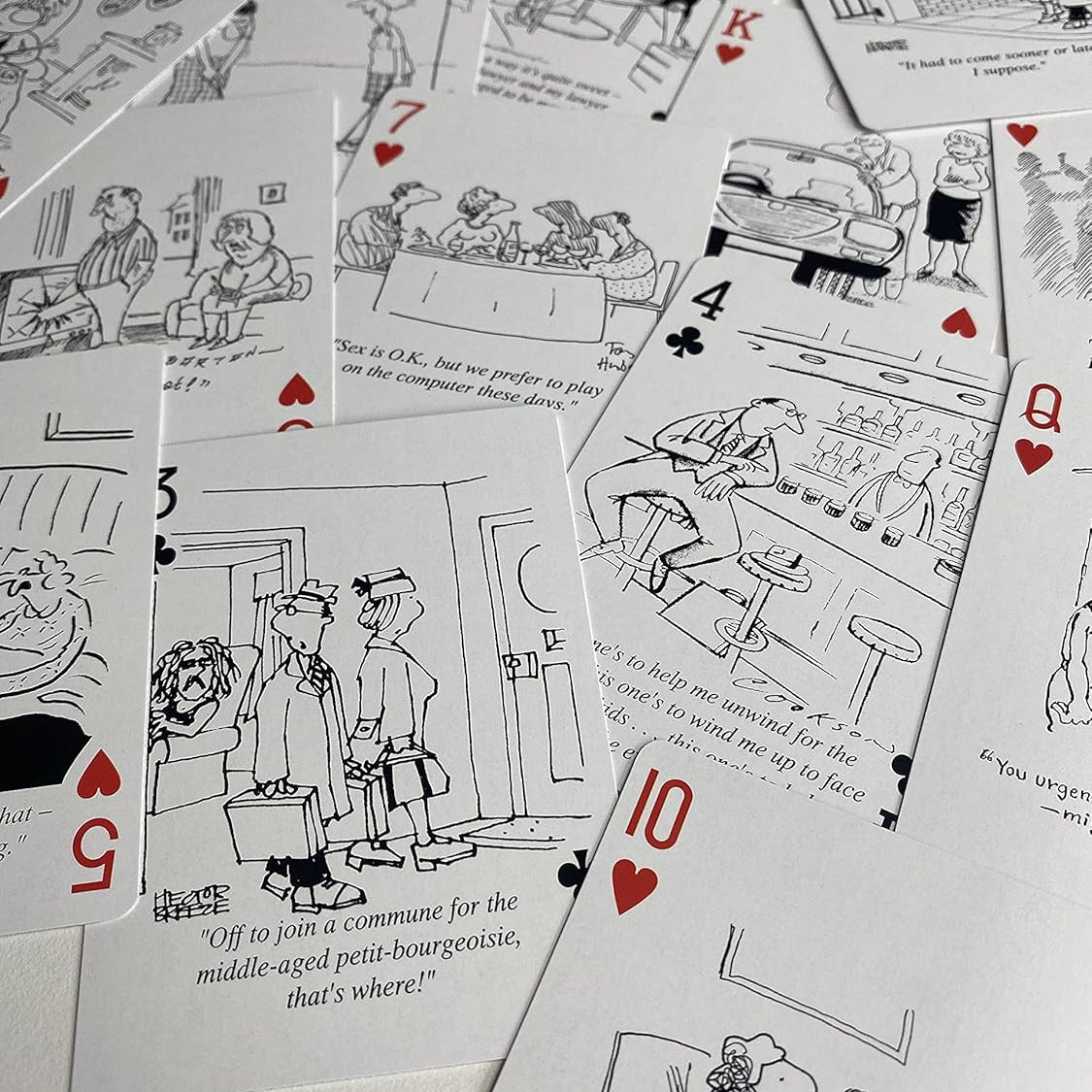 Piatnik Senior Moments deck showing black-and-white cartoons and custom gray card backs
