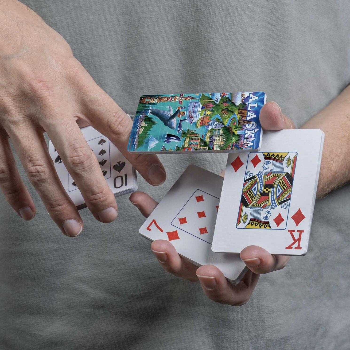 Close-up of Boardwalk Alaska’s Inside Passage card back and traditional playing-card faces