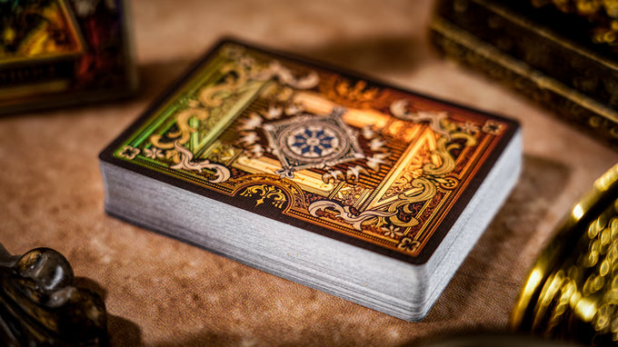 Decorative deck of cards with intricate designs on a textured surface