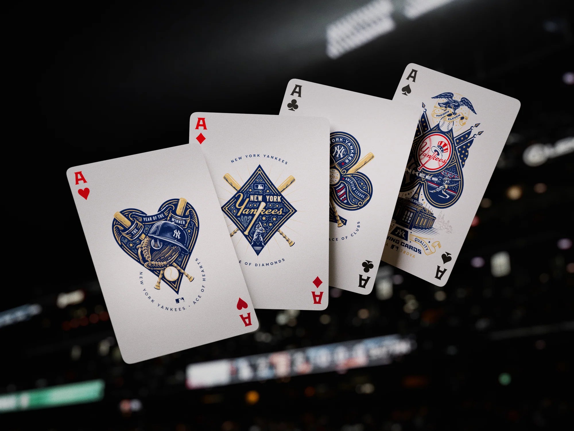 Four custom Yankees Ace cards for hearts, diamonds, clubs, and spades floating against a dark stadium backdrop.