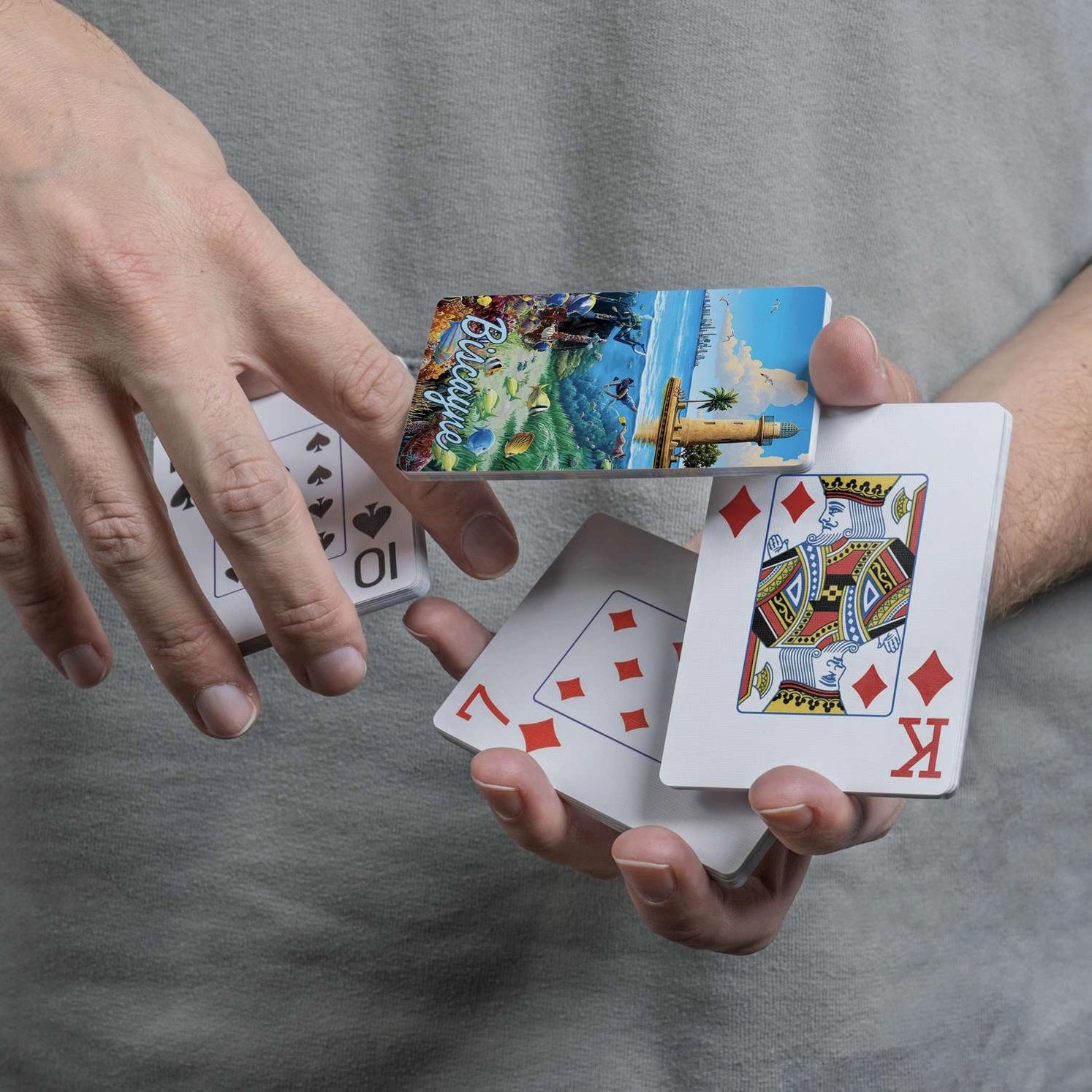 Close-up of Biscayne card back with lighthouse, ocean, and snorkelers