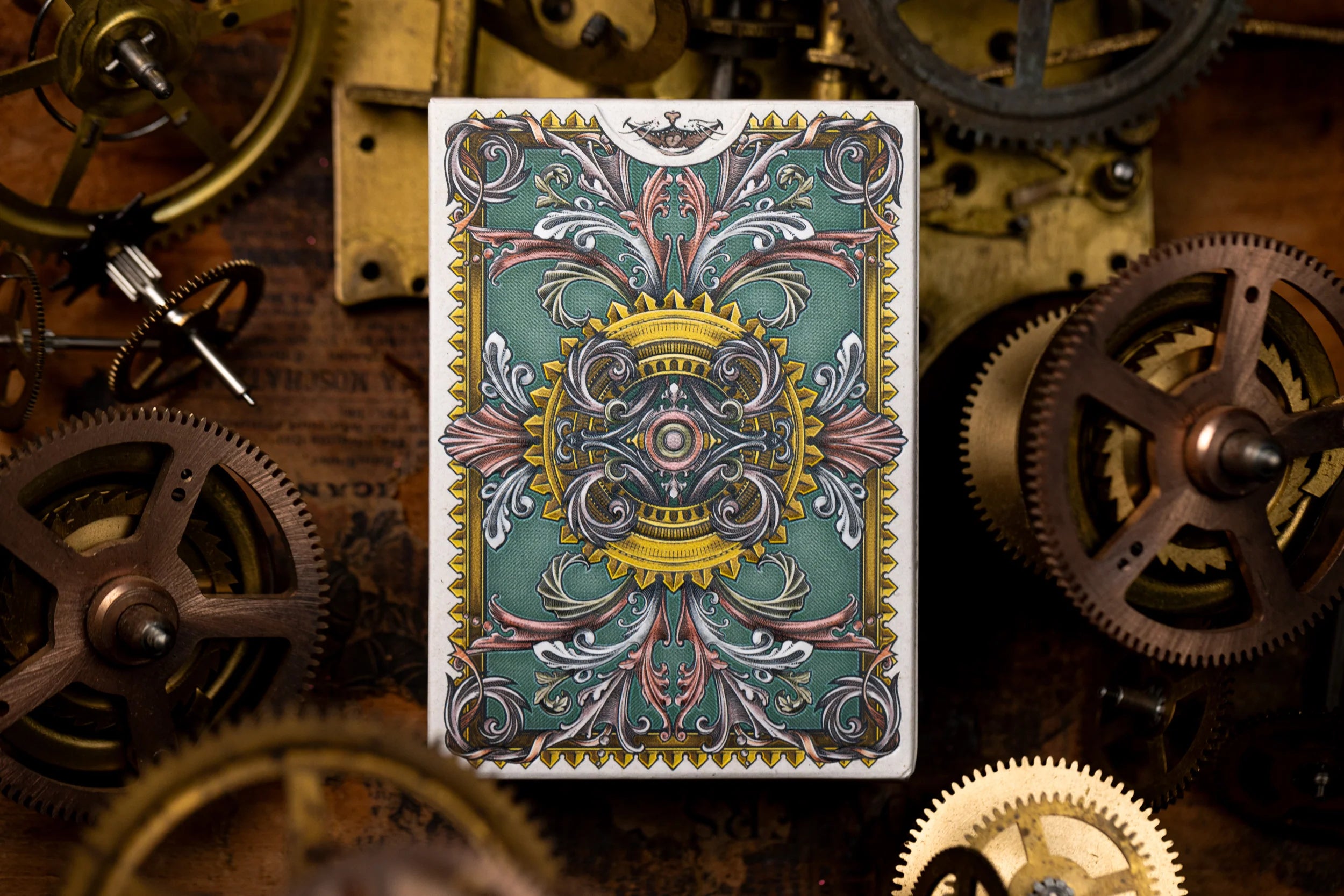 Decorative card with intricate design on a background of mechanical gears