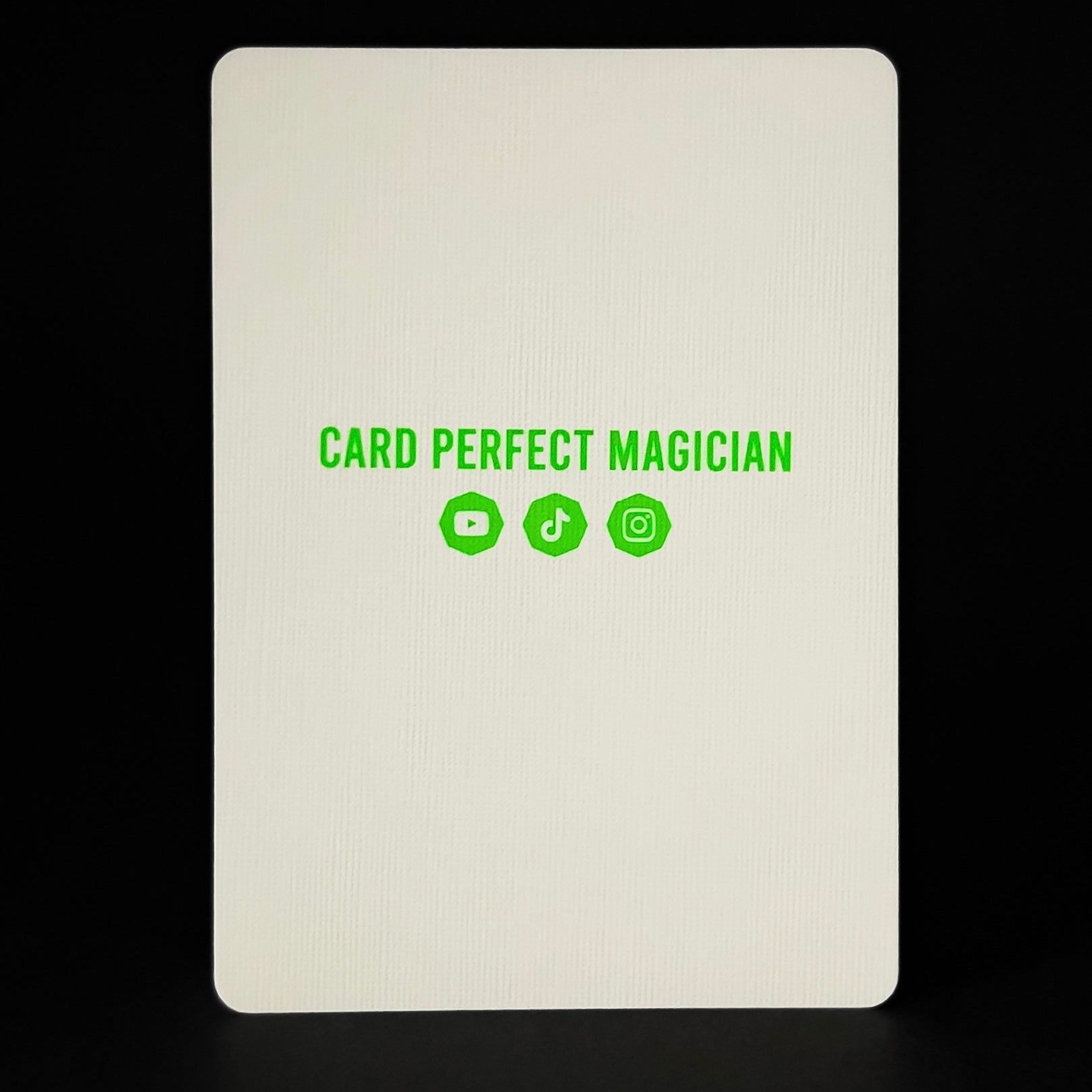 White card with 'Card Perfect Magician' text and icons on a black background