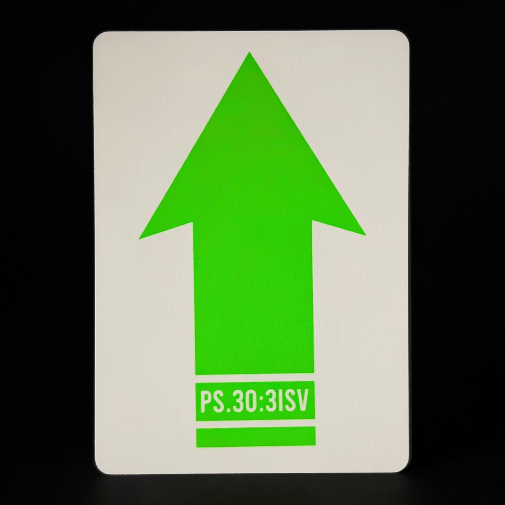 White card with a green arrow and text on a black background