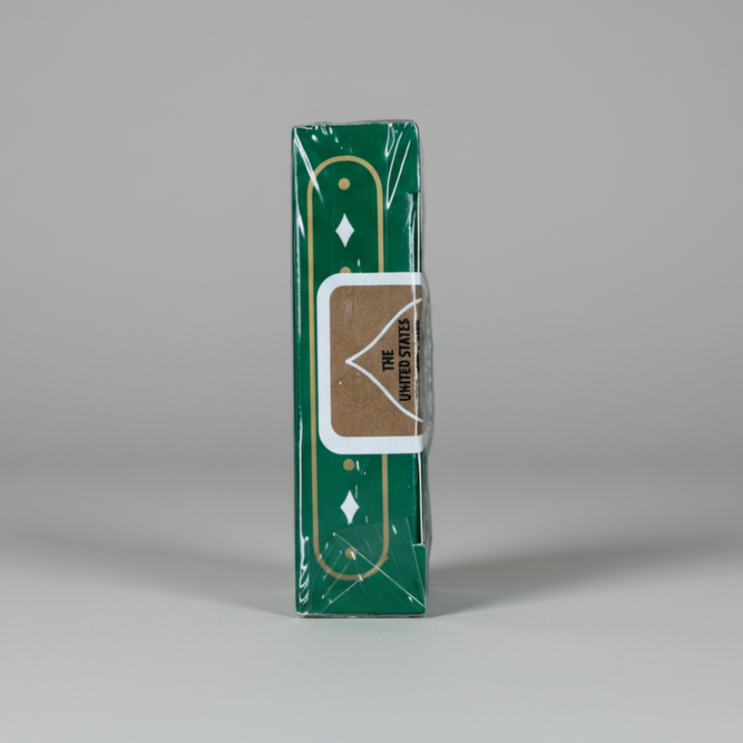 Top of currency green Aristocrat deck with 'The United States Playing Card Company' logo on a gold seal