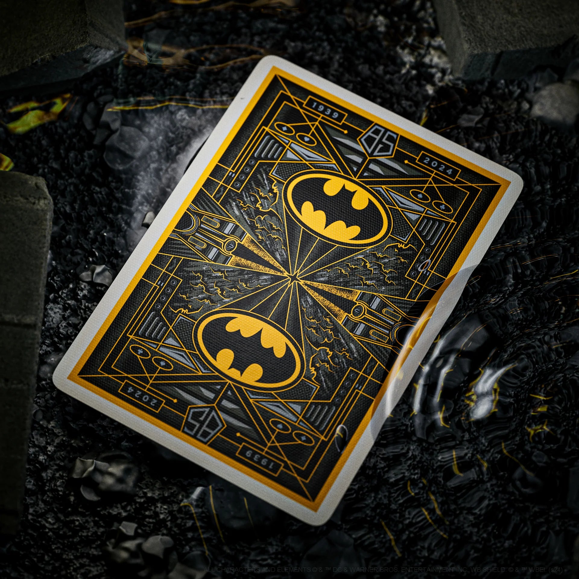Playing card with Batman logo on a dark background
