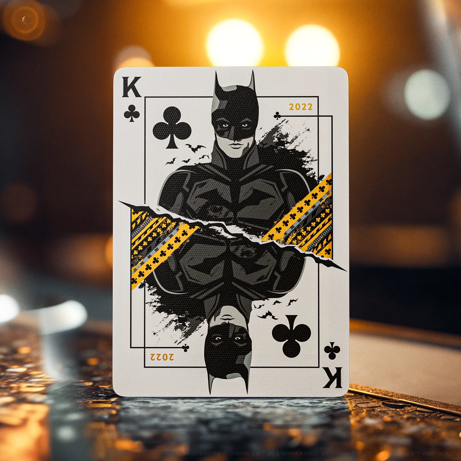 Playing card with a superhero design on a blurred background