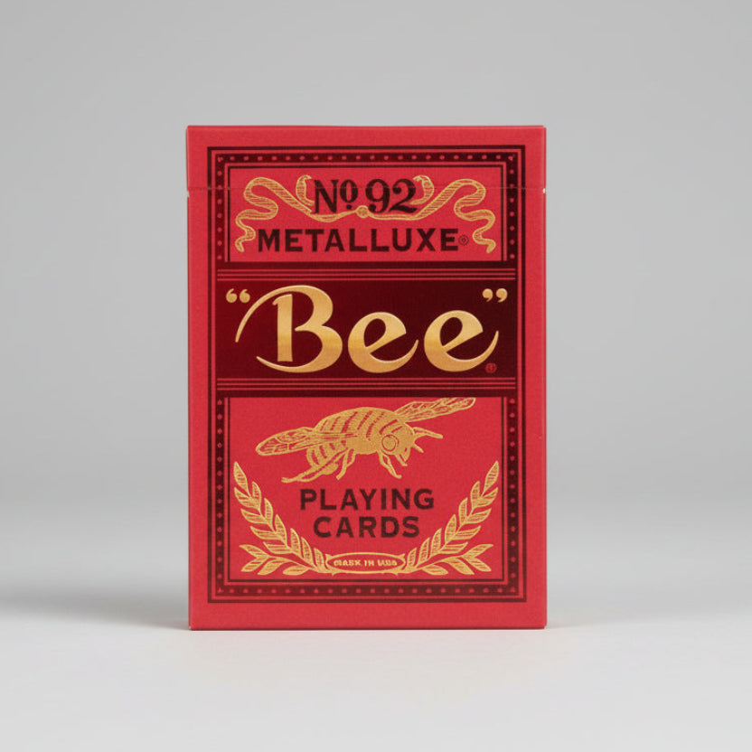 Red and gold Metalluxe playing card box with 'Bee' branding