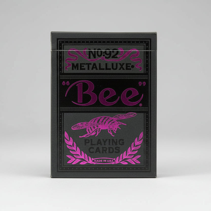 Bee Magenta & Black Metalluxe playing cards with magenta text and design on a magenta checkered background