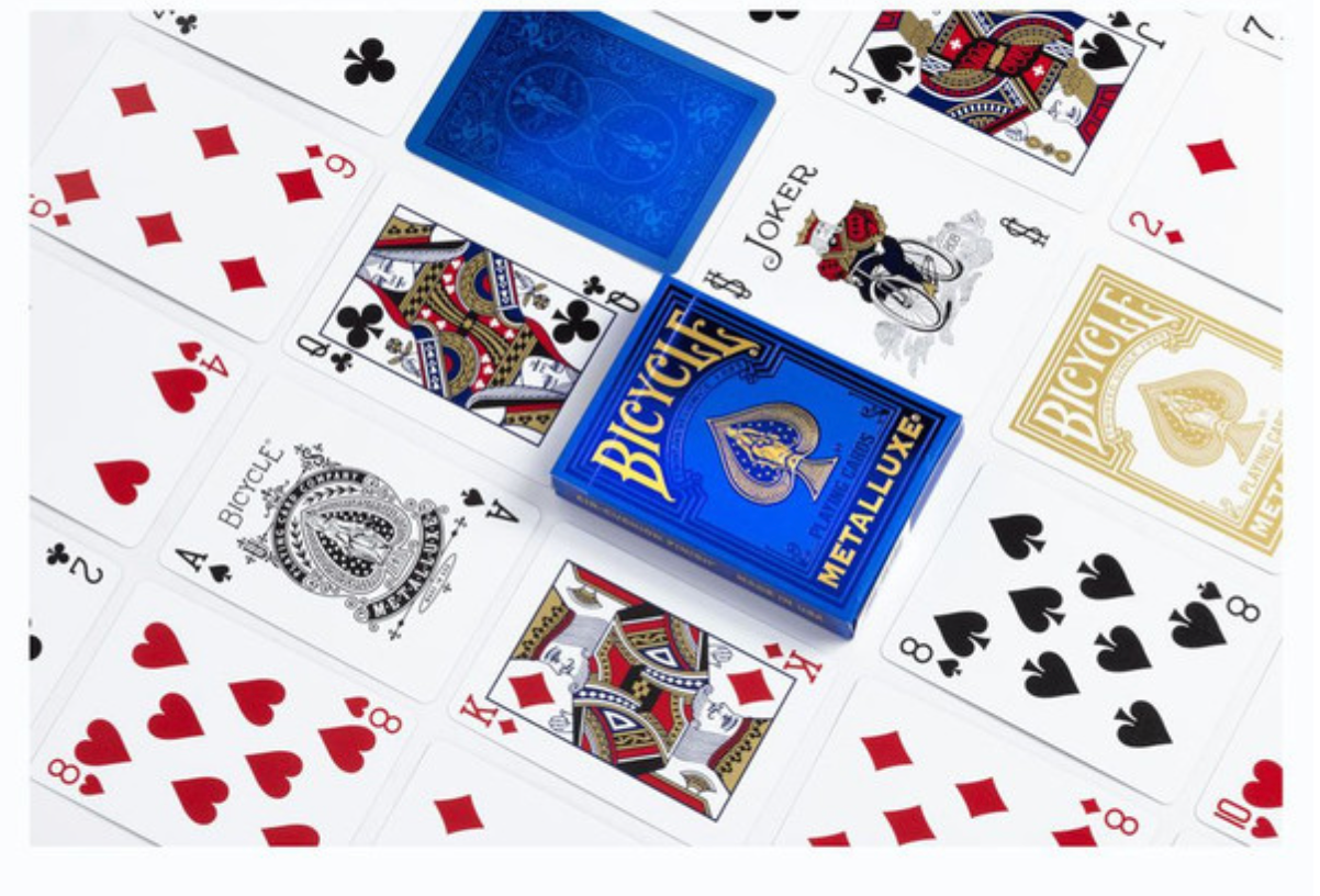 Bicycle playing cards with blue and gold packaging on a white background