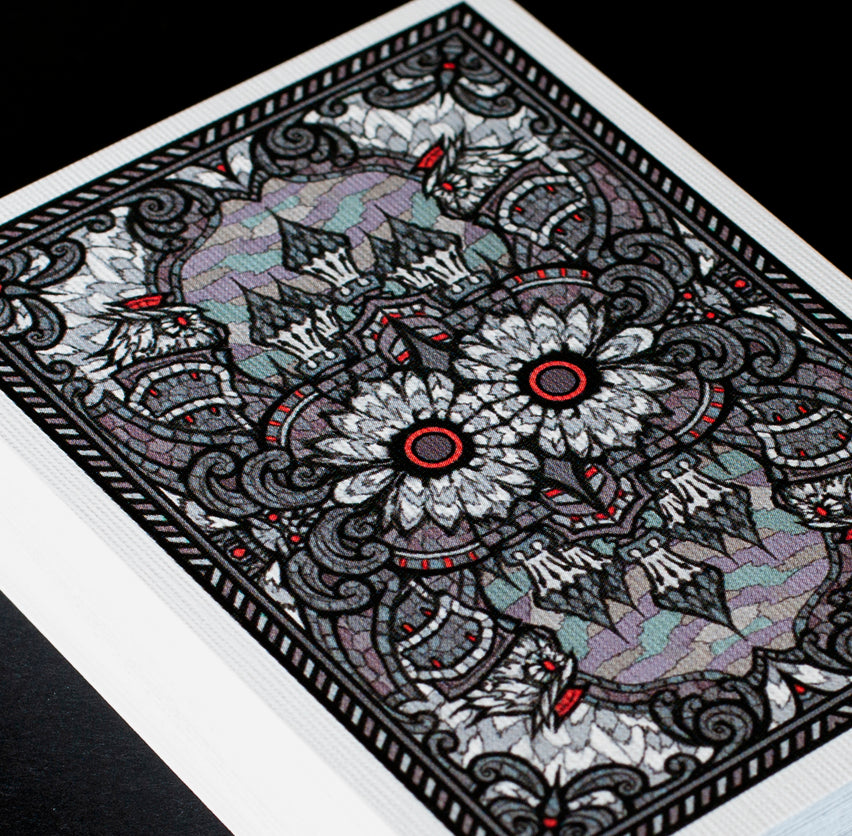 Close-up of Bicycle Owl Playing Cards Ver. 2.0 Castle Back back design with dark ornamental mirrored pattern
