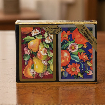 Packaged playing cards with fruit and floral design, featuring Congress Playing Cards branding.