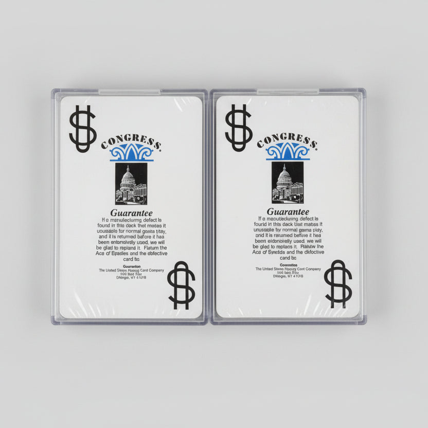 Two packs of cards with a Congress brand logo on a wooden surface