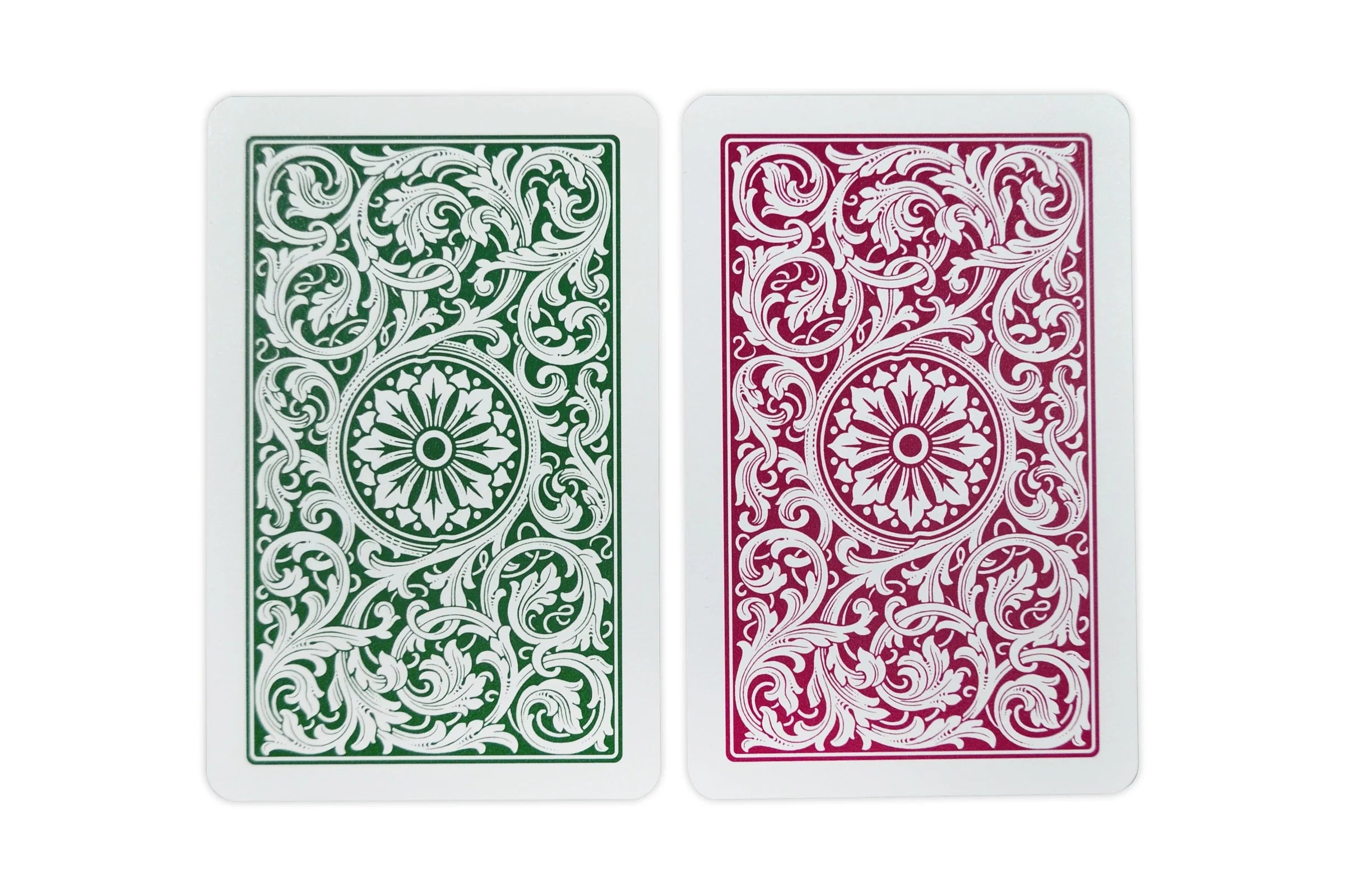 Green and burgundy Copag 1546 bridge cards arranged face down to display the detailed floral scrollwork backs.