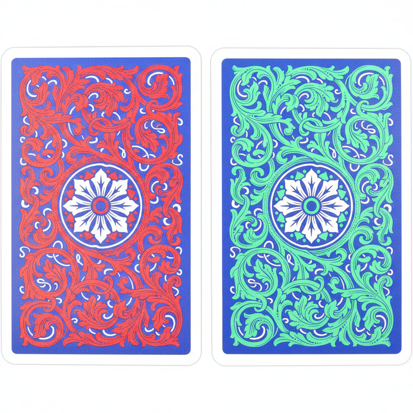 Back design of Copag 1546 Neoteric bridge cards in red and green on blue background, shown side by side.