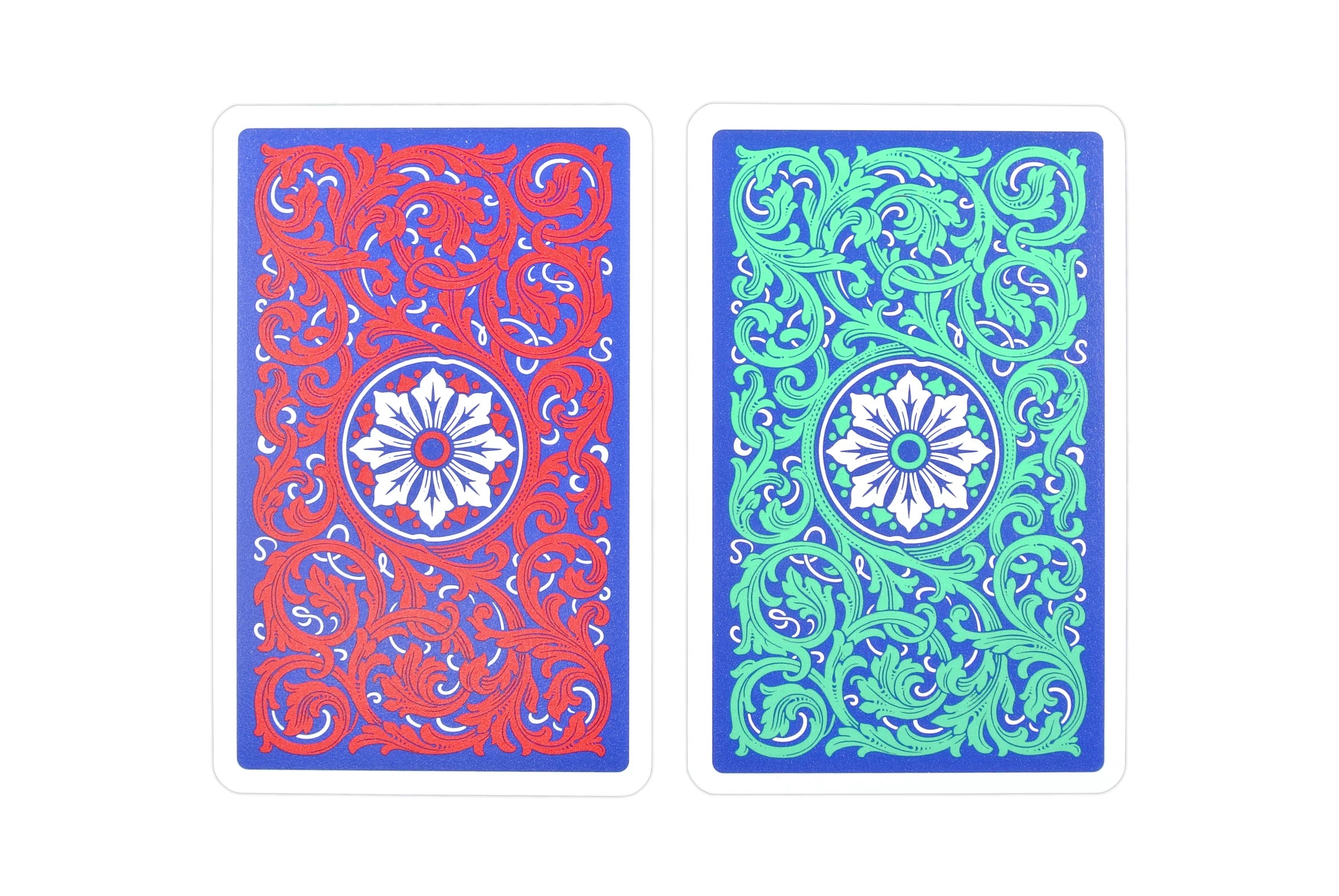Two  Copag Neoteric Bridge Size Regular Index (Red & Green) playing cards with intricate patterns on a white background