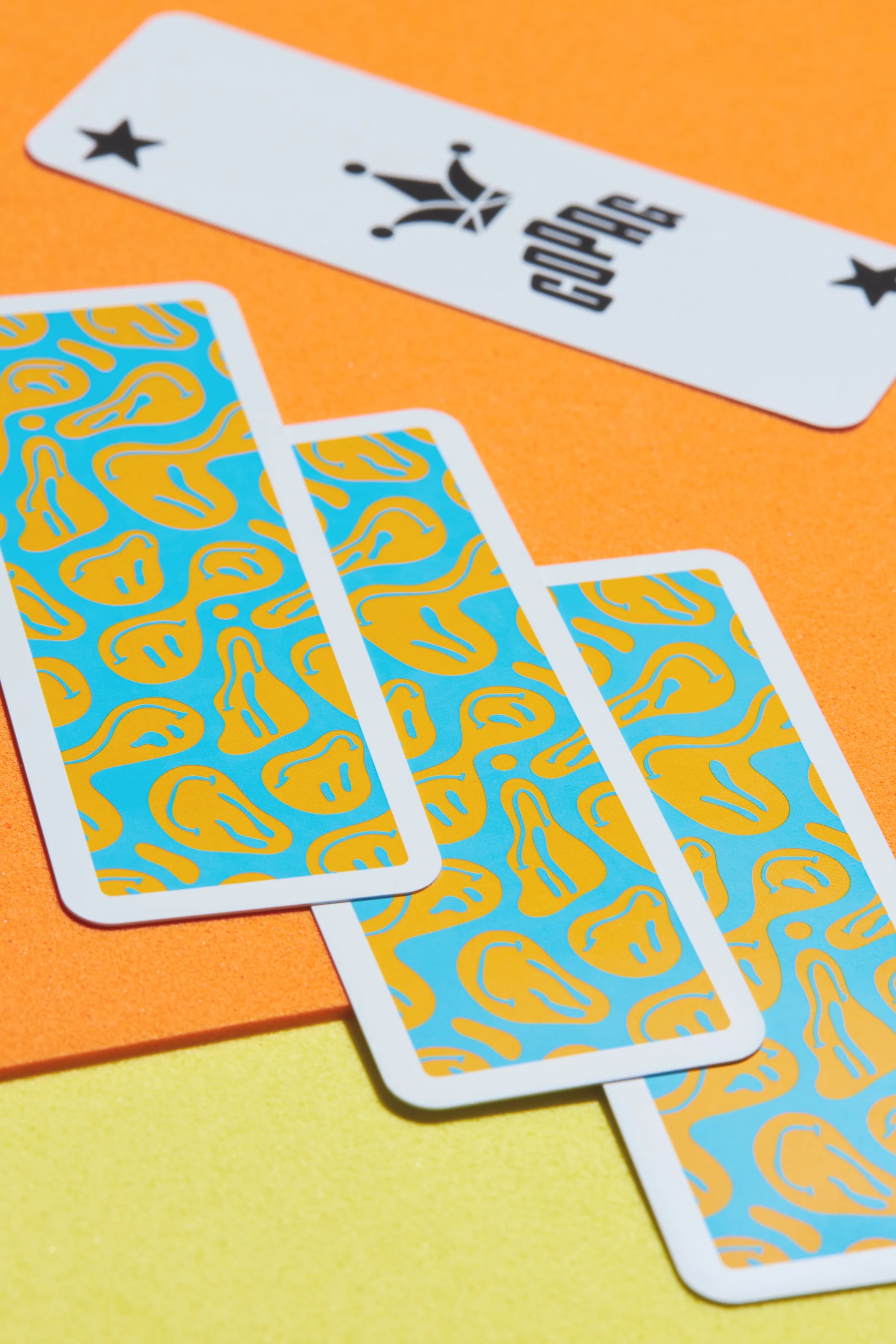 Copag Go Deck – Smiles Design Playing cards with unique designs on a colorful background