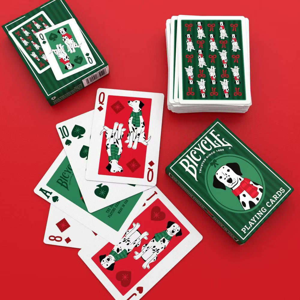 Bicycle playing cards with dog illustrations on a red background