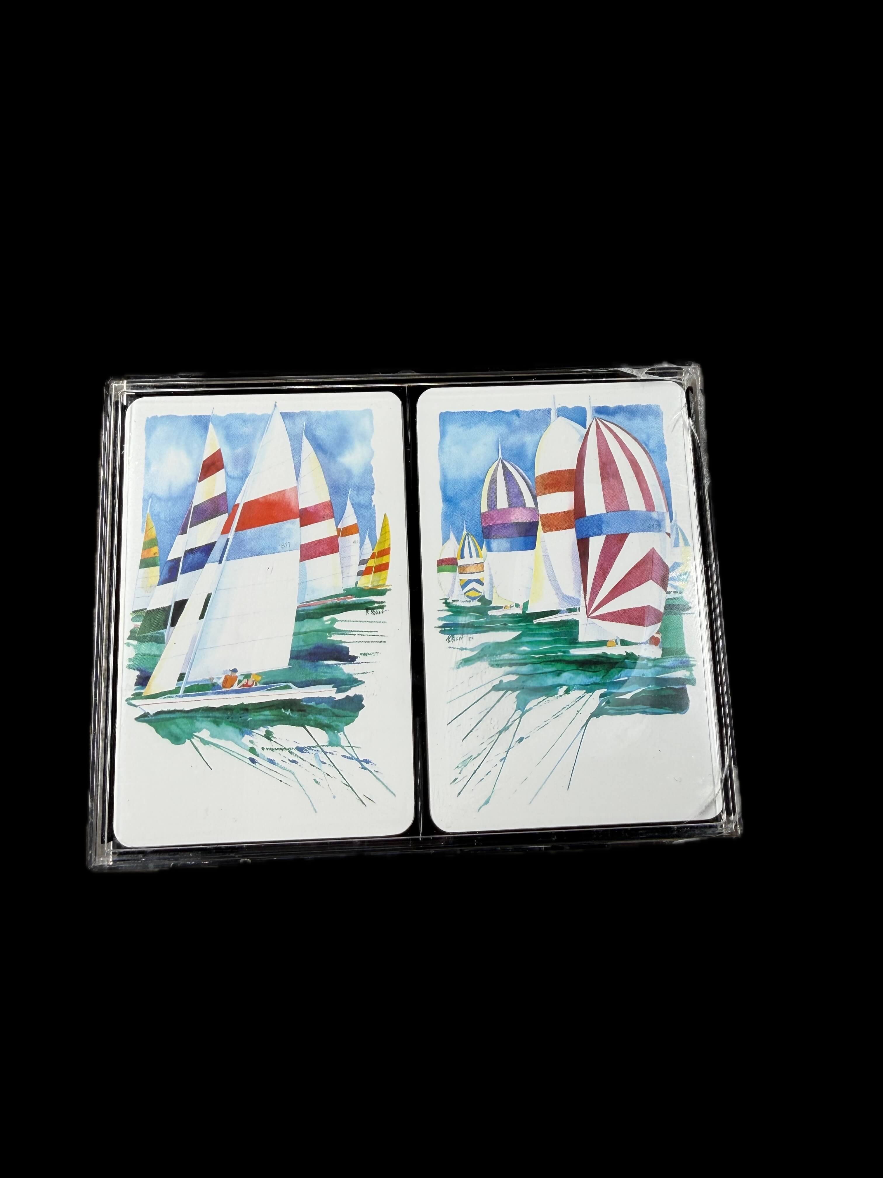 Hoyle 100% Cellulose Acetate playing cards with sailboat designs on a black background