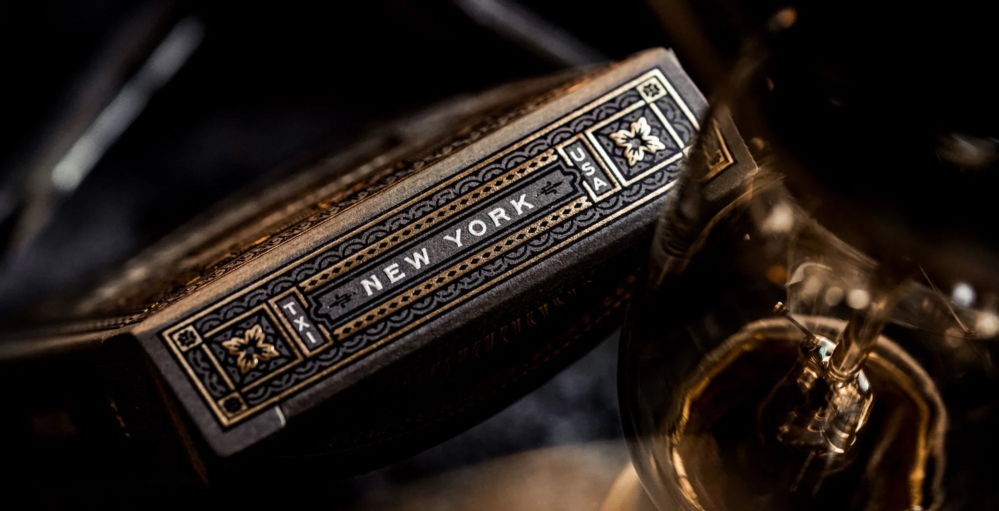 Theory11 Black Hudson tuck top edge with New York text and gold detailing