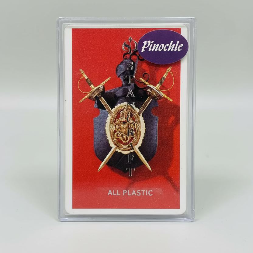 Stancraft pinochle playing card with swords on a red background, encased in clear plastic.