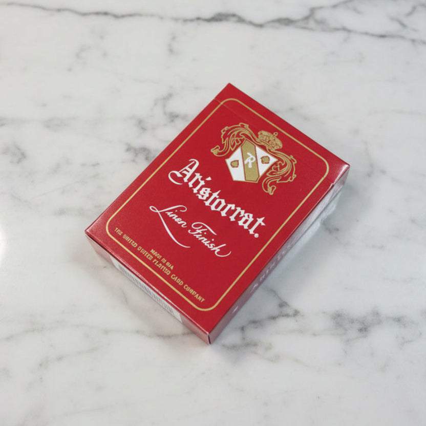 Aristocrat 727 Crimson 110th Anniversary Playing Cards deck on marble background
