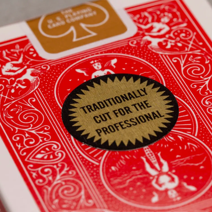 Red playing card box with gold text and design
