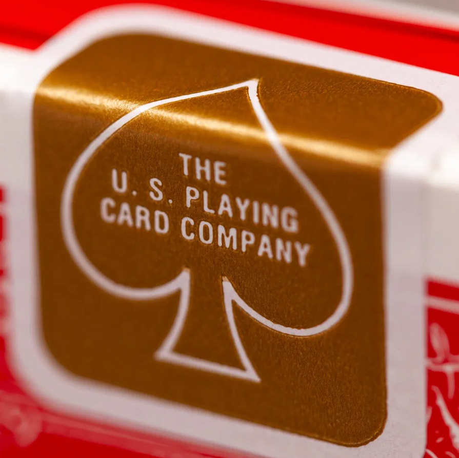Close-up of a playing card with 'The U.S. Playing Card Company' logo.