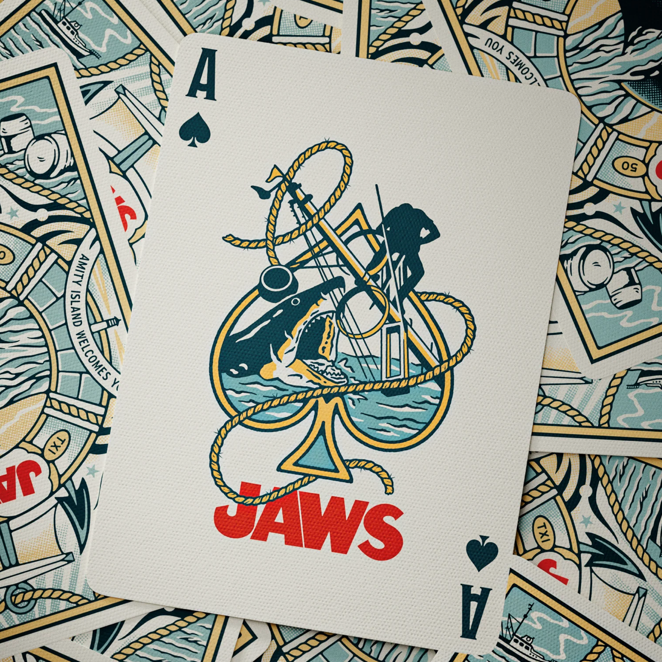 Theory11 JAWS ace of spades with custom shark-hunt artwork on JAWS card backs