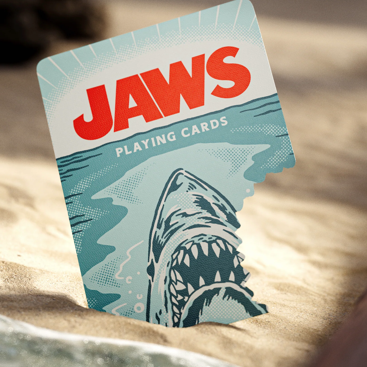 Theory11 JAWS tuck box front close-up with shark rising from the water