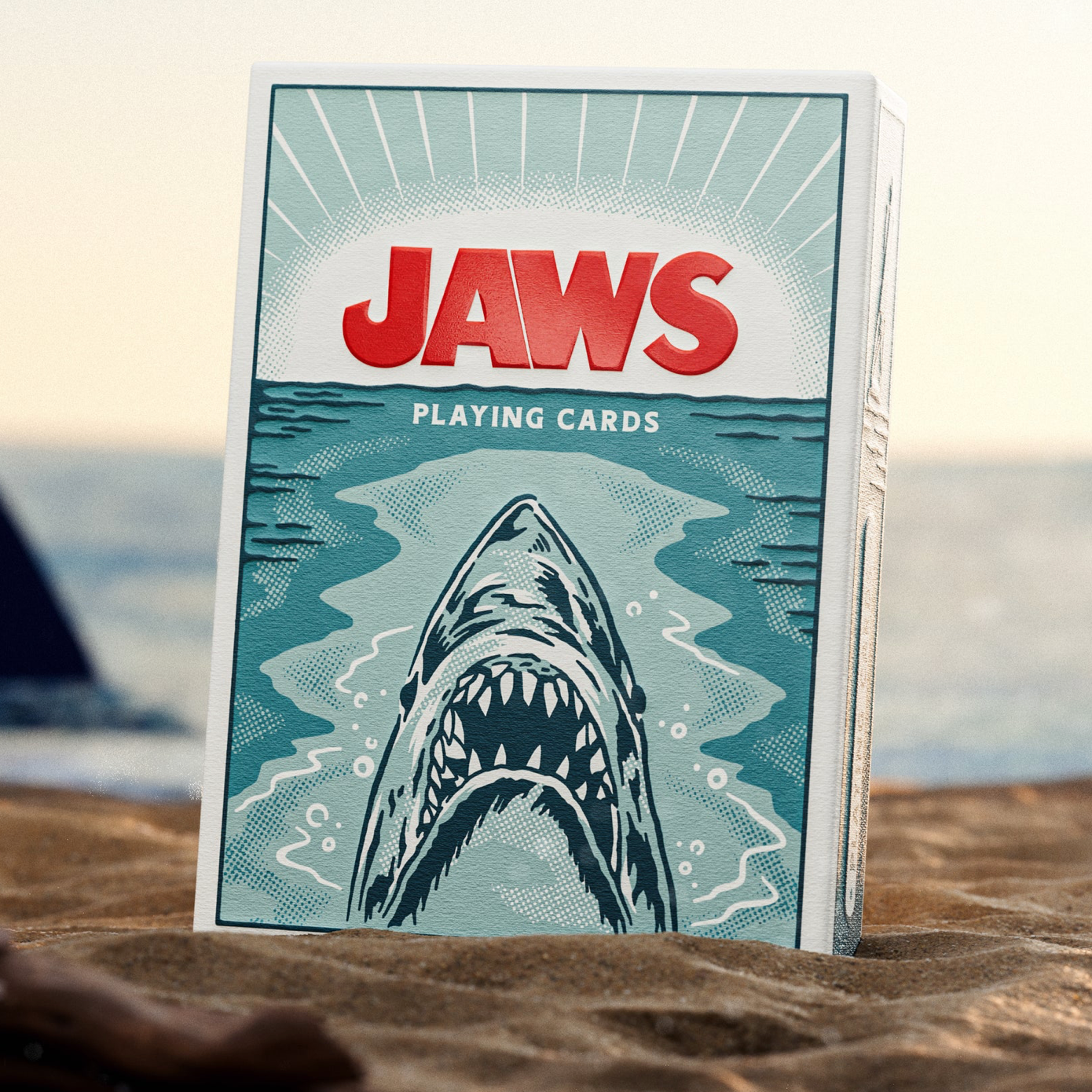 Theory11 JAWS tuck box front standing in sand with ocean background
