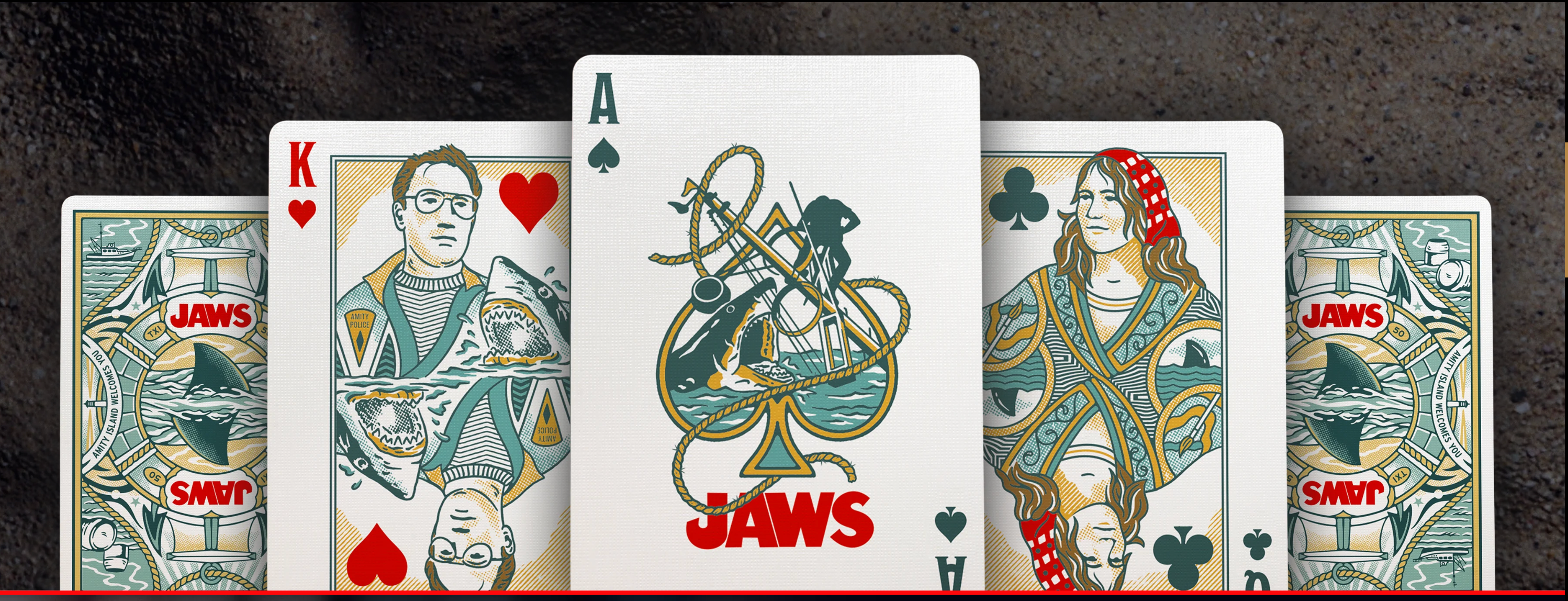 Theory11 JAWS playing cards spread with custom courts, ace, and card backs