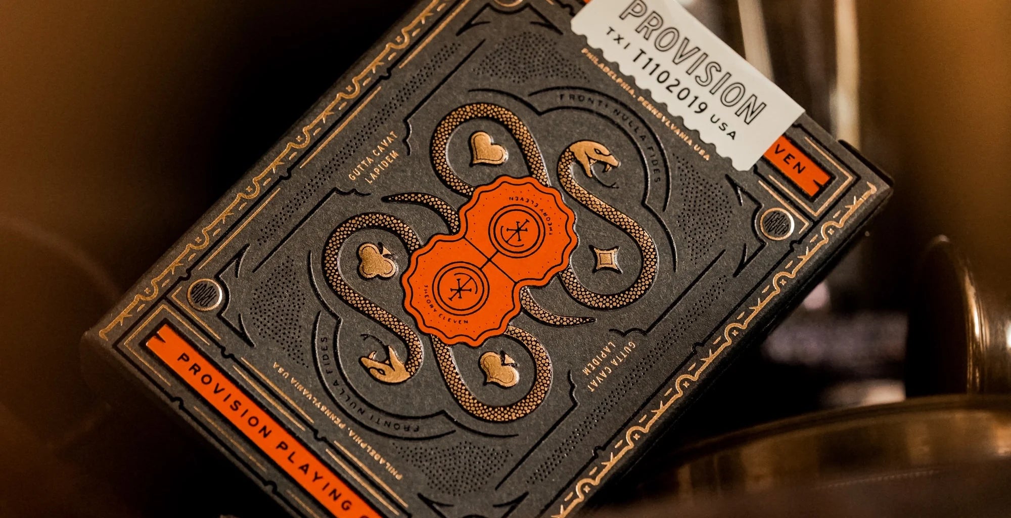Playing card deck with intricate design and 'Provision' branding on a dark background