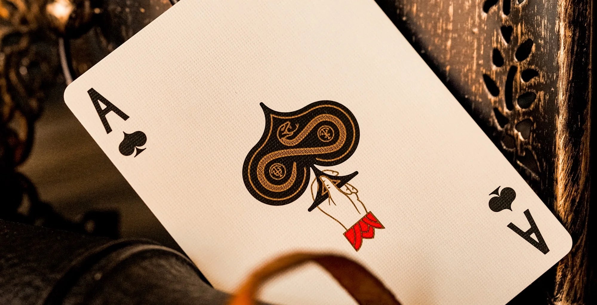 Playing card with ace of spades design on a wooden surface