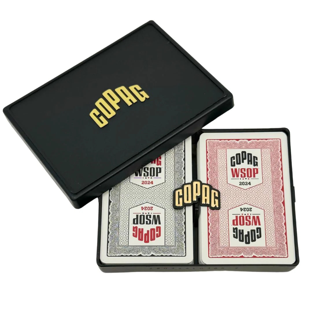 Two decks of COPAG WSOP 2024 playing cards in a black box on a white background