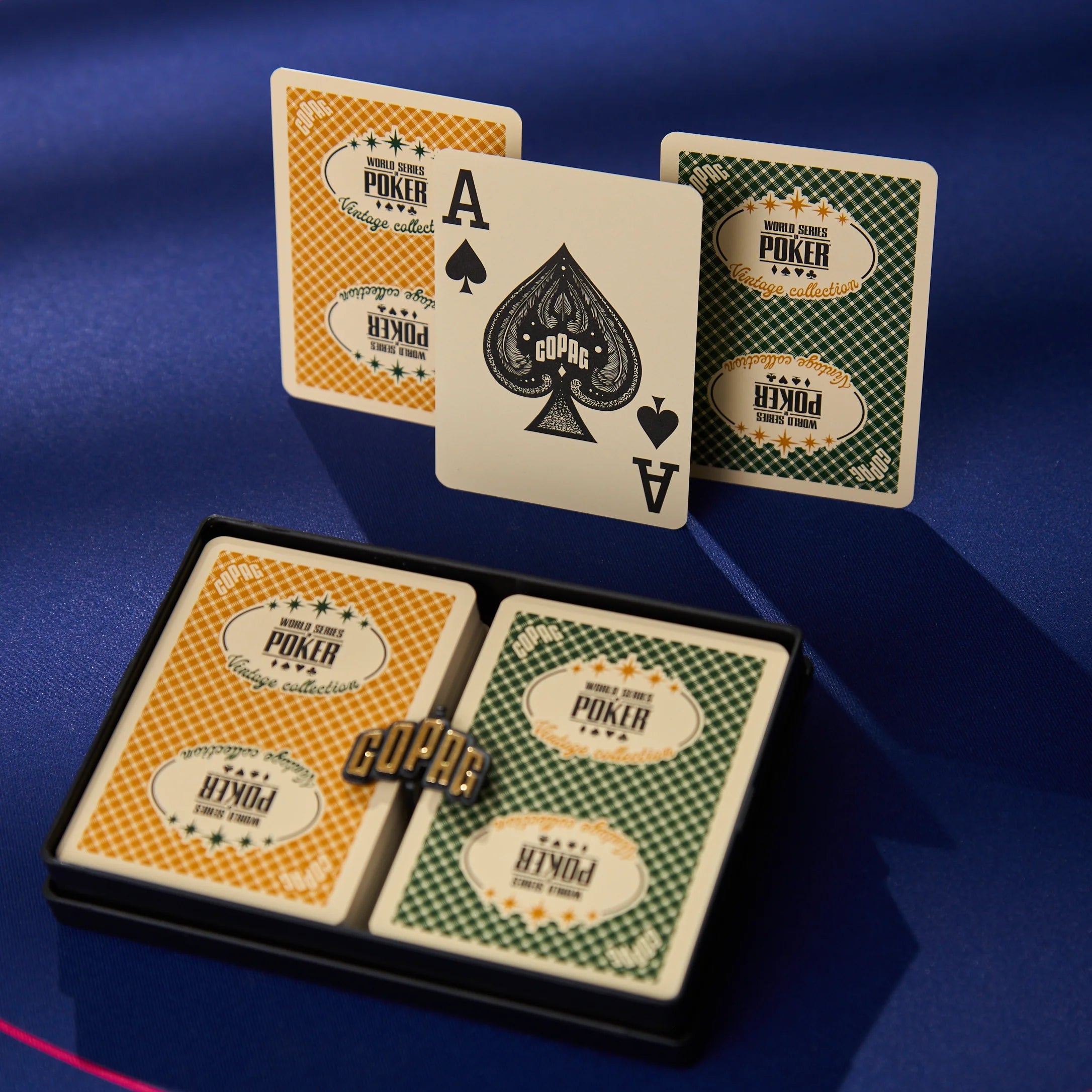 Copag WSOP Vintage Collection green and gold poker-size jumbo-index cards displayed on blue poker table