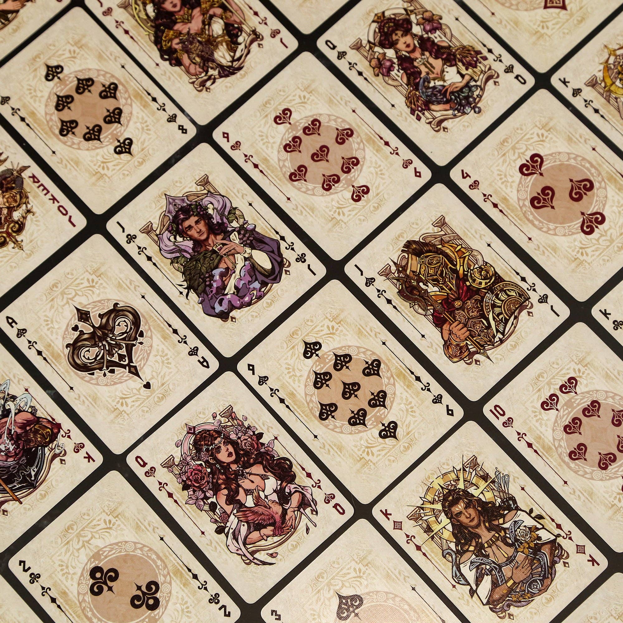 Pattern of playing card suits with decorative illustrations on a beige background