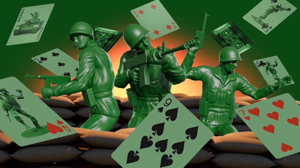 Three green Army Men figures surrounded by custom playing cards and battlefield sandbags