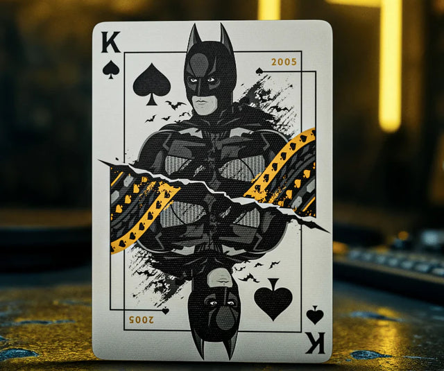 Playing card with Batman design on a dark background