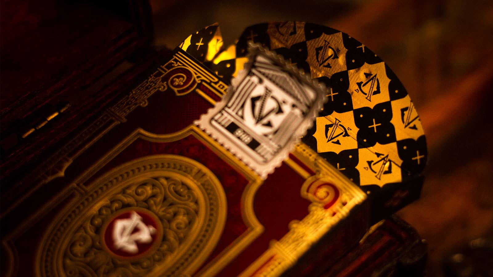 Decorative Centurio deck with intricate designs and symbols on a dark background