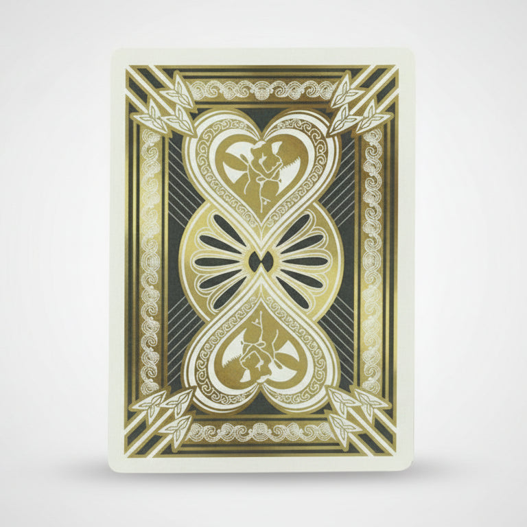 Decorative playing card with gold and black design on a white background