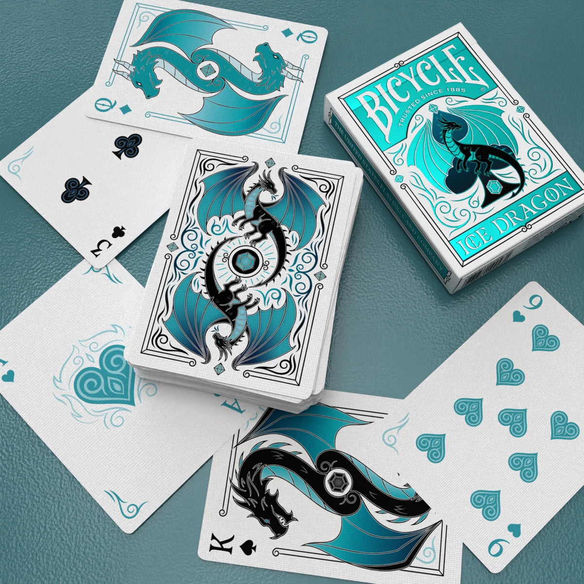 Bicycle Ice Dragon face-down deck and tuck box surrounded by dragon Kings, an Ace, and number cards